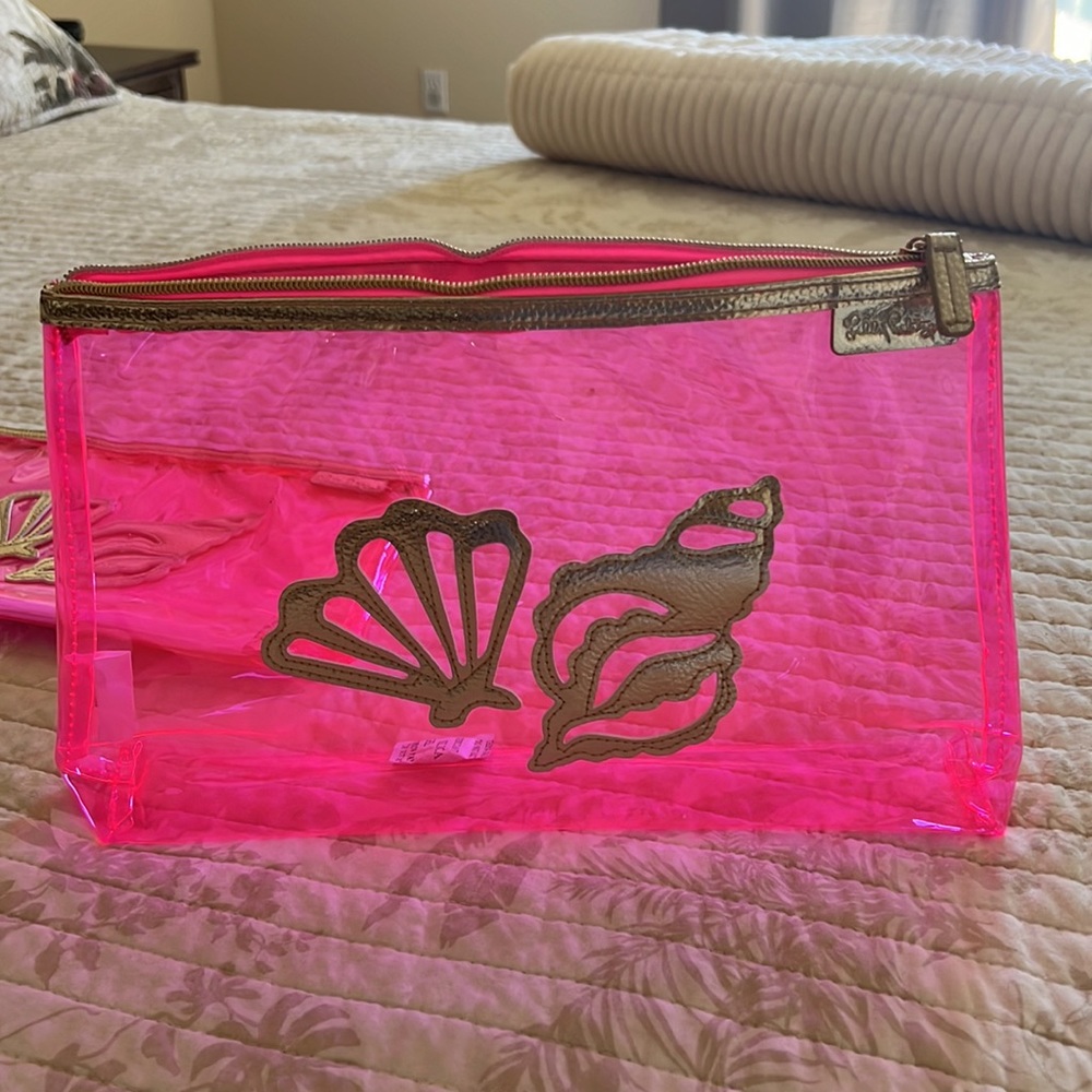 Lilly Pulitzer clear hot pink/ gold clutch.